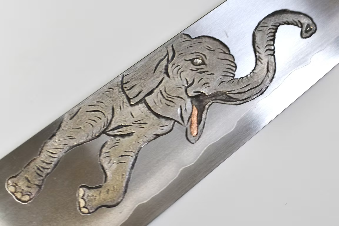 Sakai Takayuki Metal Decorated Engraving by Kubota Elephant Calf Silver Steel No.3 Gyuto 240mm Ebony Wood (ferrule: Black Water Buffalo Horn And Silver Ring) Handle