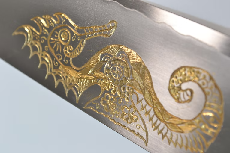 Sakai Takayuki Gold Filled Engraving by Kubota Seahorse Silver Steel No.3 Santoku 180mm Ebony Wood (ferrule: Black Water Buffalo Horn And Silver Ring) Handle