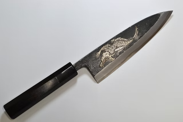 Sakai Takayuki Metal Decorated Engraving by Kubota Crocodile White Steel No.2 Black Finished Deba 165mm Ebony Wood (ferrule: Black Water Buffalo Horn And Silver Ring) Handle
