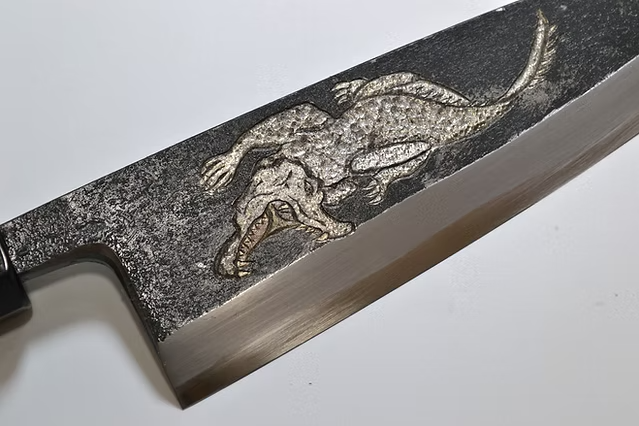 Sakai Takayuki Metal Decorated Engraving by Kubota Crocodile White Steel No.2 Black Finished Deba 165mm Ebony Wood (ferrule: Black Water Buffalo Horn And Silver Ring) Handle