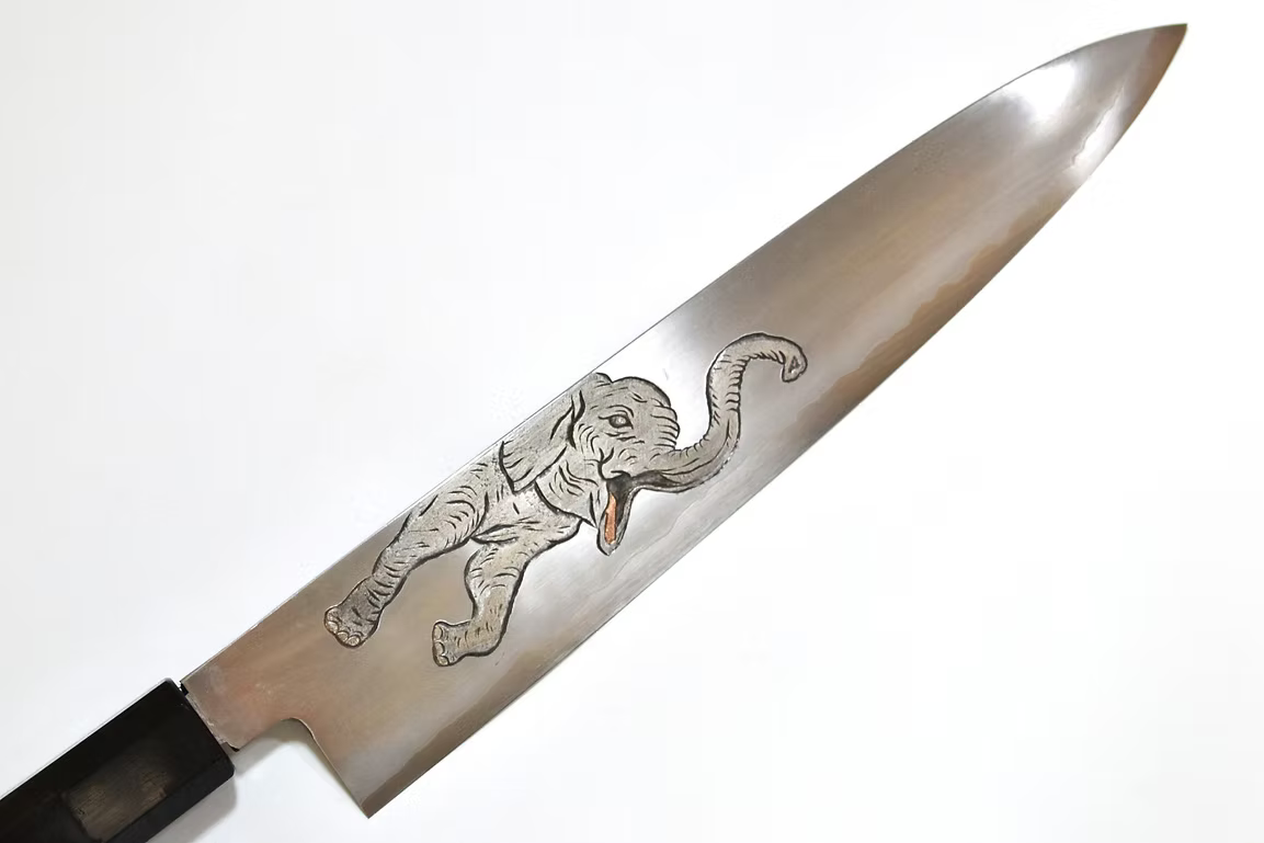 Sakai Takayuki Metal Decorated Engraving by Kubota Elephant Calf Silver Steel No.3 Gyuto 240mm Ebony Wood (ferrule: Black Water Buffalo Horn And Silver Ring) Handle