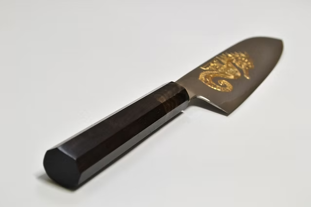 Sakai Takayuki Gold Filled Engraving by Kubota Seahorse Silver Steel No.3 Santoku 180mm Ebony Wood (ferrule: Black Water Buffalo Horn And Silver Ring) Handle