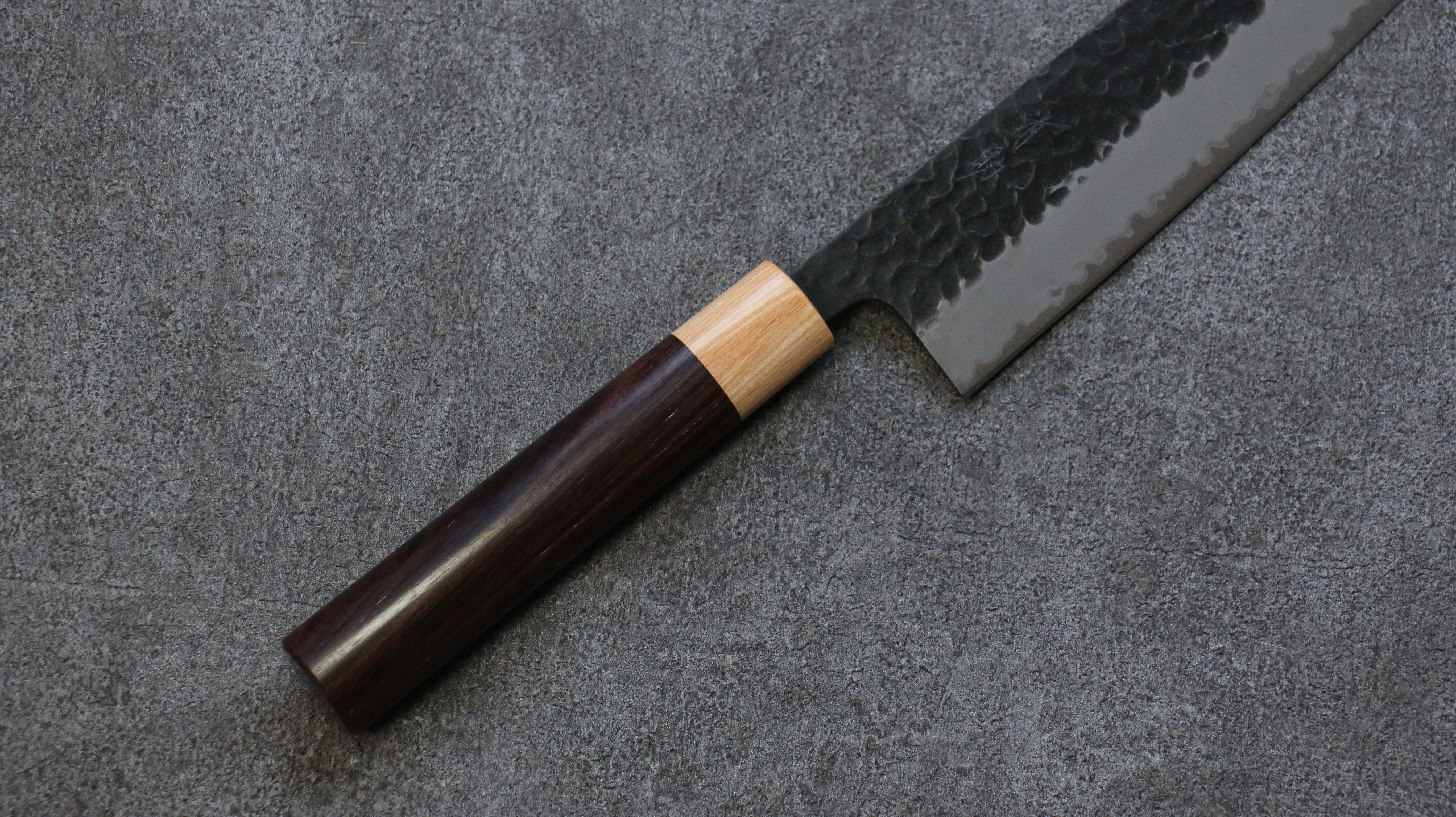 Seisuke Shitan Blue Super Hammered Kurouchi Gyuto 240mm Shitan Handle - Japanny - Best Japanese Knife